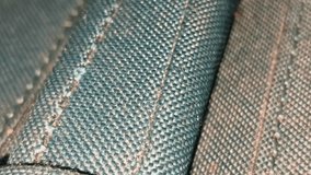 Close-up of blue stitched textile, emphasizing threads, seams, fabric weave, and craftsmanship, highlighting individual textile fibers and surface texture. - Powered by Shutterstock - Get 15% off with code: PIKWIZARD15