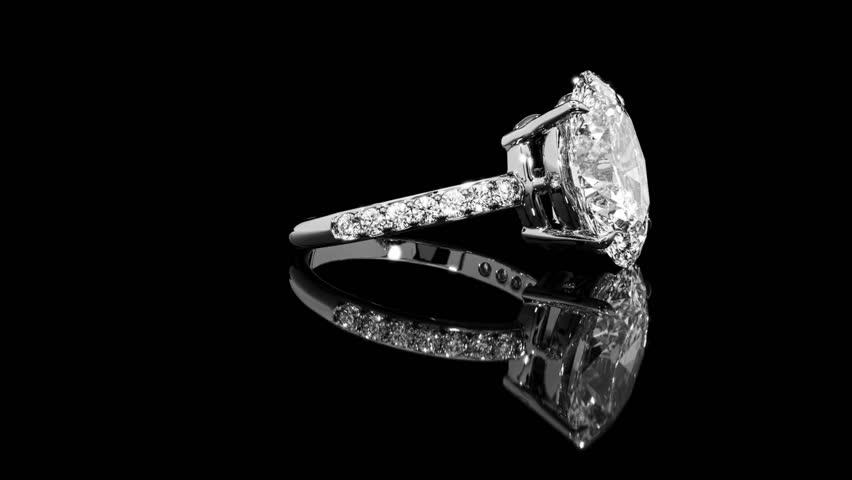 High-quality close-up video of a luxurious white gold diamond ring displayed on a clean white background. Perfect for use in jewelry advertisements, wedding concepts, engagement promotions