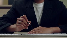 Businesswoman using stylus on a futuristic dashboard with global map, bar charts, and analytics interface. Overlay includes video playback controls, data visualization, and team icon. - Powered by Shutterstock - Get 15% off with code: PIKWIZARD15