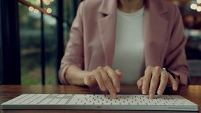 Businesswoman working on keyboard with futuristic data analytics interface and digital graphs, symbolizing business intelligence, performance tracking, and strategic data-driven decisions. - Powered by Shutterstock - Get 15% off with code: PIKWIZARD15
