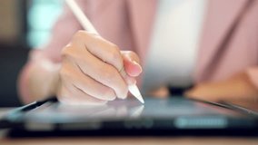 Close-up of a businesswoman using a stylus to interact with a futuristic digital dashboard showing big data analytics, global charts, and KPI metrics, symbolizing smart business and data strategy. - Powered by Shutterstock - Get 15% off with code: PIKWIZARD15