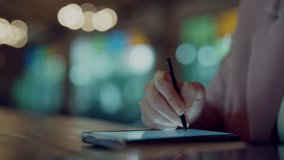 Close-up of businesswoman using stylus on digital tablet with holographic world map and location markers, representing global network, GPS tracking, logistics, international business - Powered by Shutterstock - Get 15% off with code: PIKWIZARD15