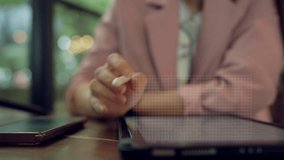 Close-up of businesswoman using stylus on a digital tablet with futuristic pie charts. Data visualization and analytics interface shown as a transparent holographic overlay in modern workspace. - Powered by Shutterstock - Get 15% off with code: PIKWIZARD15