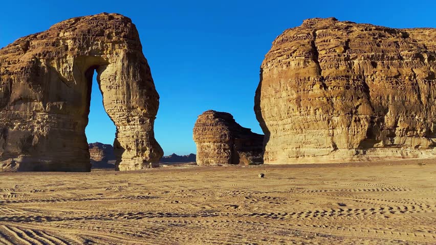 Pan shot of the historical Elephant Rock in Al Ula, Saudi Arabia, highlighting desert landscape, natural wonder, sandstone formation, heritage tourism, and iconic Middle Eastern cultural landmark.