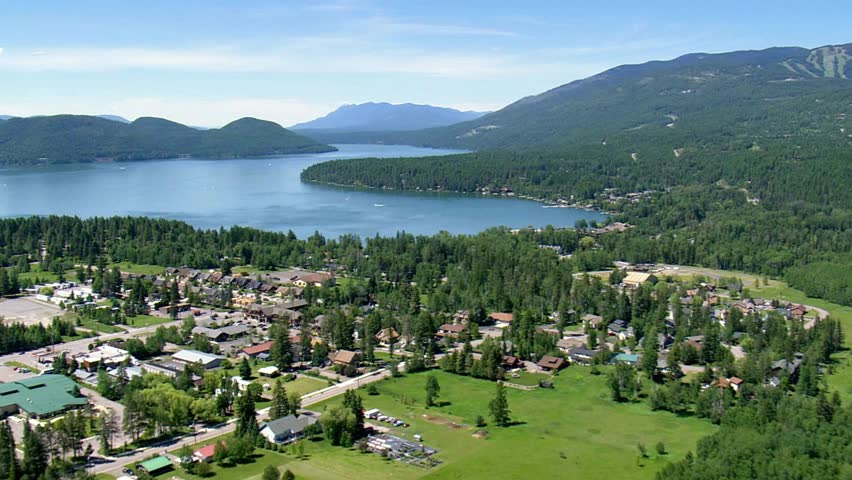 Aerial view of whitefish, montana, showcasing the lake, mountains, and town