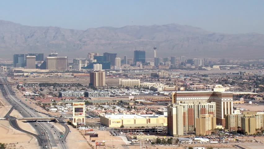 An aerial view of the las vegas skyline with mountains in the background