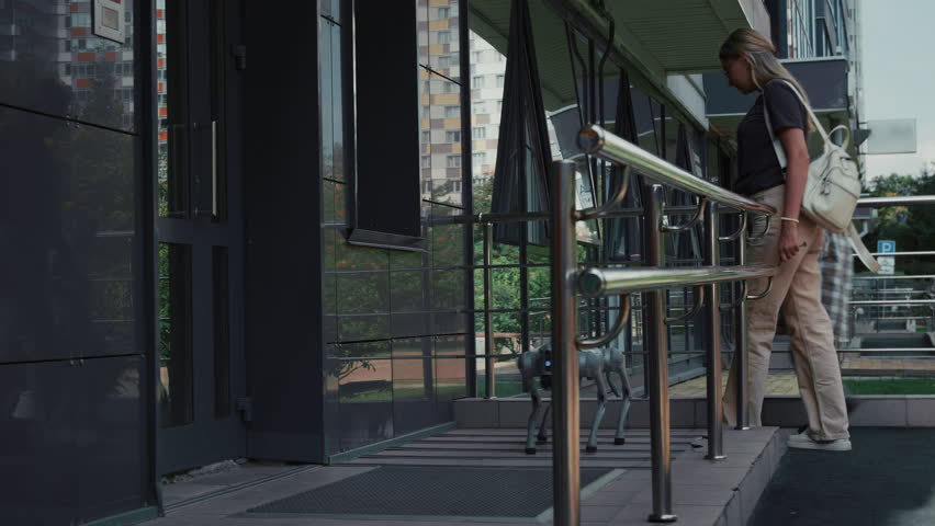 A mother and child come back from a walk with a robot dog and enter the entrance of a modern house. - Powered by Shutterstock - Get 15% off with code: PIKWIZARD15