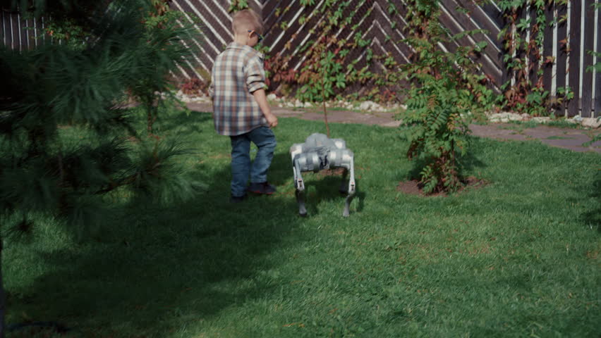 Child walking his futuristic robotic pet dog on a leash in the backyard on a sunny summer day - Powered by Shutterstock - Get 15% off with code: PIKWIZARD15