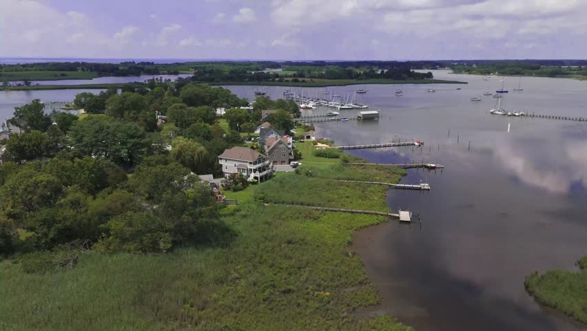 Aerial drone view of waterfront homes in Rock Hall, Maryland, showcasing coastal living and scenic Chesapeake Bay.