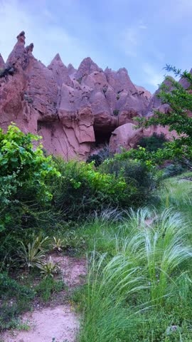 The picturesque Zelve Valley in cloudy weather in Turkey. Unusual rock formations that tell ancient stories about Cappadocia. Rocks that once had houses carved by ancient inhabitants. 4K