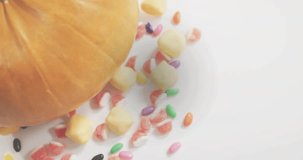 Binary digits drifting down over pumpkin and candies, starting at second frame for digital overlay. Technology, data, coding, digital, futuristic, abstract, cybersecurity - Powered by Shutterstock - Get 15% off with code: PIKWIZARD15