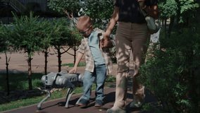A modern robotic dog accompanies a woman and child on a casual walk in the park. - Powered by Shutterstock - Get 15% off with code: PIKWIZARD15