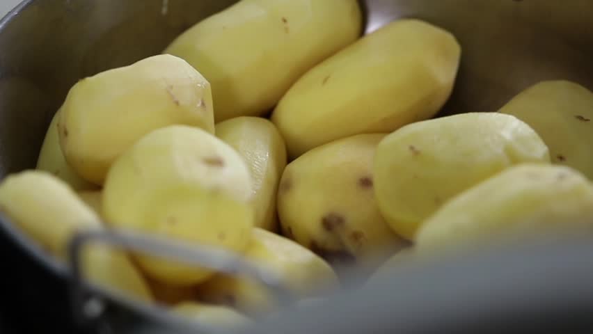 Closeup shot of peeled potatoes. Potatoes closeup.