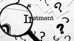 Magnifying Glass Searching for Investment Among Question Marks and Words - Powered by Shutterstock - Get 15% off with code: PIKWIZARD15