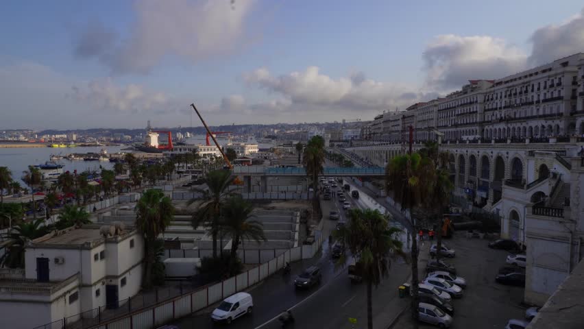 Capital of Algeria, Algiers is the capital and largest city of Algeria, situated on Mediterranean coast of Northern Africa, City view of Algiers and its old white buildings, Port of Algiers.