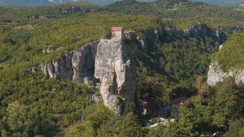 Drone view of Katskhi Pillar, a monastery built on a tall rock in Georgia