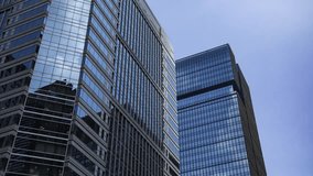A timelapse of cloud reflecting the office building in the business town zoom - Powered by Shutterstock - Get 15% off with code: PIKWIZARD15