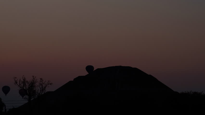 Hot Air Balloons Over Pyramid of the Sun at Sunrise, Teotihuacan,  Mexico - 4K time lapse video