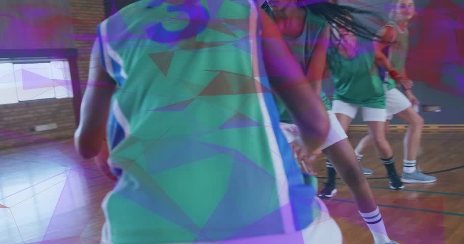 sports player dribbling past defenders and releasing ball arcing through net for score. Athletics, teamwork, determination, motion, competition, fitness, sportswear