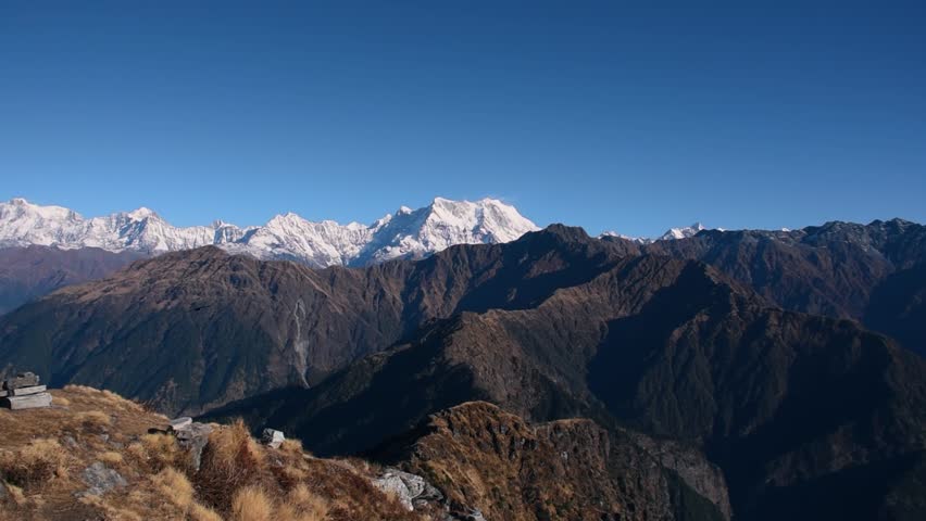 Panoramic view of the majestic Himalayan mountains from Chandrashila summit, Chopta, Uttarakhand, India. Chandrashila, standing at an altitude of 12,083 ft above sea level, offers breathtaking scenery