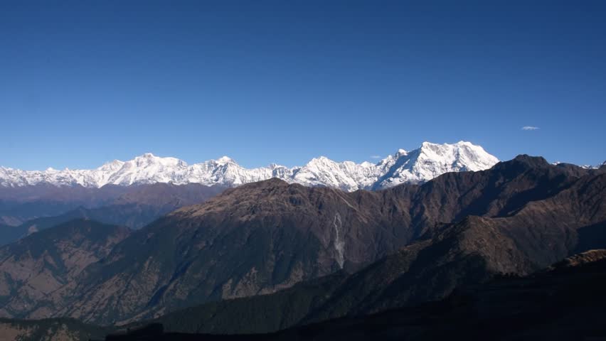 Panoramic view of the majestic Himalayan mountains from Chandrashila summit, Chopta, Uttarakhand, India. Chandrashila, standing at an altitude of 12,083 ft above sea level, offers breathtaking scenery