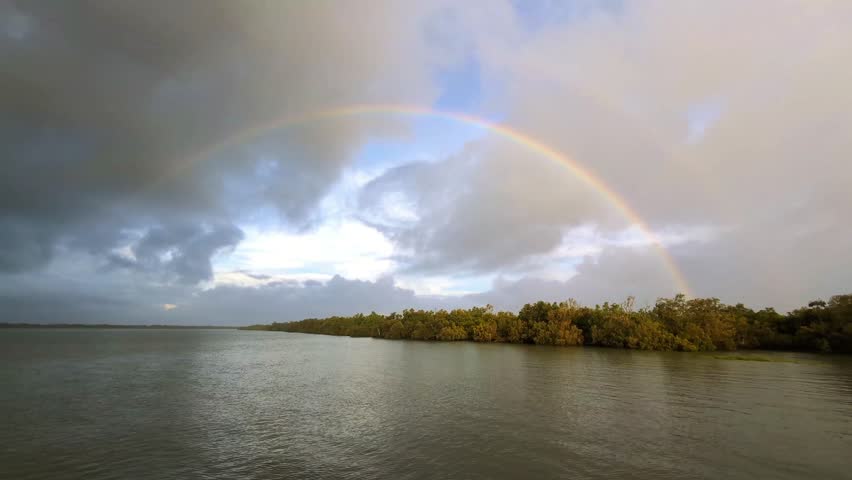 4k 60p UHD video footage of a double rainbow seen in the Sundarban National Park of West Bengal in India after a heavy spell of monsoon rain