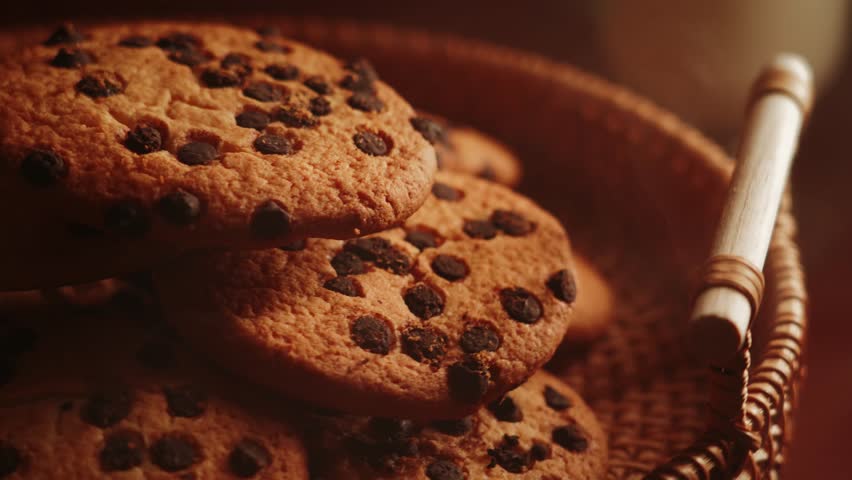Freshly baked chocolate chip cookies cooling in a cozy kitchen