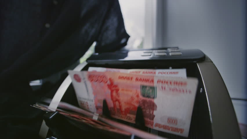 5000 Russian Ruble banknotes. Bank automatic equipment for counting paper money. Money counting machine, investment capital operations. RUB cash, credit. Business accounting. Wide angle lens.