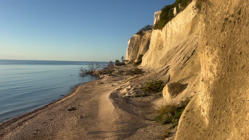 Summer at the White Cliffs of Mons Klint, at Dronningstolen, in the Danish Part of the Baltic Sea. Mon Island, Mons Klint, Chalk cliffs. High view of the beach at Mons Klint isle of Mon. Nature
