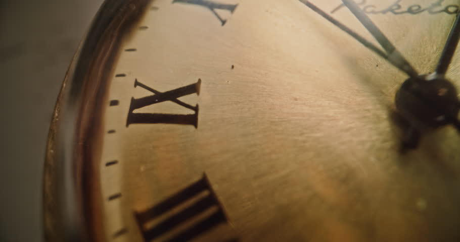 Macro Close Up Shot of Antique Pocket Watch with Roman Numerals and Running Second Hand. Vintage Design and Warm Golden Tones. Concept of Passing Time, History, Nostalgia and Elegance. Time Lapse.
