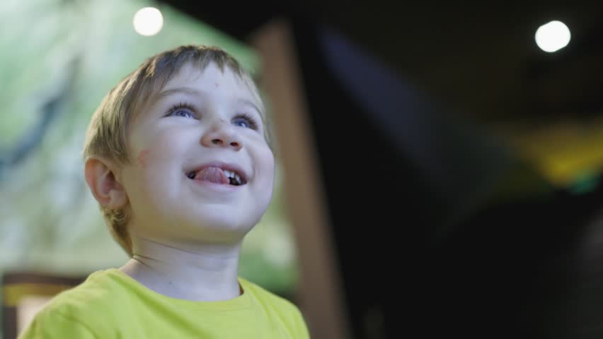 Little boy with blue eyes expressing wonder and awe