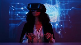 businesswoman wearing virtual reality glasses demonstrates how to use a data management system, business intelligence, data statistics, marketing analysis,key performance indicators  - Powered by Shutterstock - Get 15% off with code: PIKWIZARD15