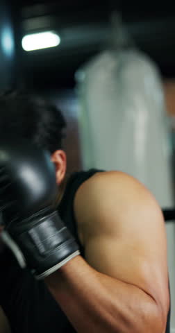 Boxing, sparring and sports with people in gym together for combat or self defense training. Boxer, power and strike with professional athletes in ring for exercise, fitness or workout routine