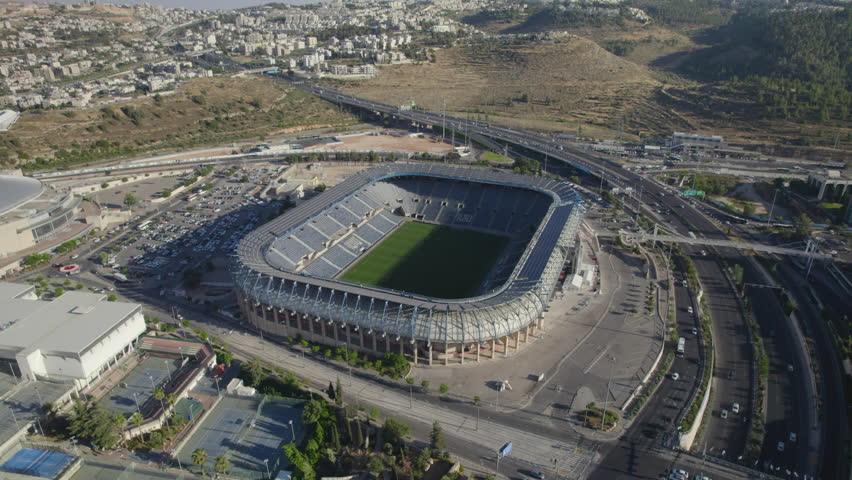 Teddy Stadium Jerusalem, israel embraces sunset warmth in this composed parallax shot highlighting quiet solitude