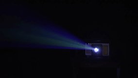  Projector lighting up the dark. A vintage projector illuminates the dark, creating a magical atmosphere perfect for film lovers.  Illuminating swirling dust particles, cinematic noir aesthetic. - Powered by Shutterstock - Get 15% off with code: PIKWIZARD15