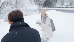 Happy Asian couple playing in snow together while travel nature countryside on winter holiday vacation. Man and woman in winter coat enjoy and fun outdoor lifestyle travel forest mountain in snowy day - Powered by Shutterstock - Get 15% off with code: PIKWIZARD15
