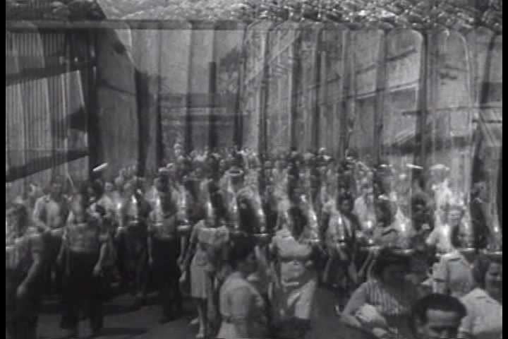 1940s - 1944 factory footage of workers making propeller blades and assemblies for World War Two aircraft.
