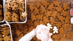Flat lay. Crafting gingerbread cookie sandwiches with eggnog buttercream, presented on a rustic wooden table for Christmas gifting. - Powered by Shutterstock - Get 15% off with code: PIKWIZARD15