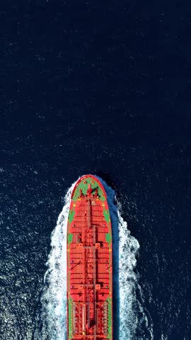 Aerial tracking of a oil tanker ship sailing over the ocean with copy space as a concept for transport and shipping