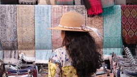 Female traveler shopping for vibrant shawls and scarves at Dilli Haat in Delhi , India exploring handmade ethnic fabrics and handicrafts, 4k Pro-resolution cultural shopping and tourism video - Powered by Shutterstock - Get 15% off with code: PIKWIZARD15