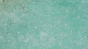 Extreme close-up of bubbling turquoise water in motion, showing splashes, droplets, and texture, likely from a pool or water feature.
 - Powered by Shutterstock - Get 15% off with code: PIKWIZARD15