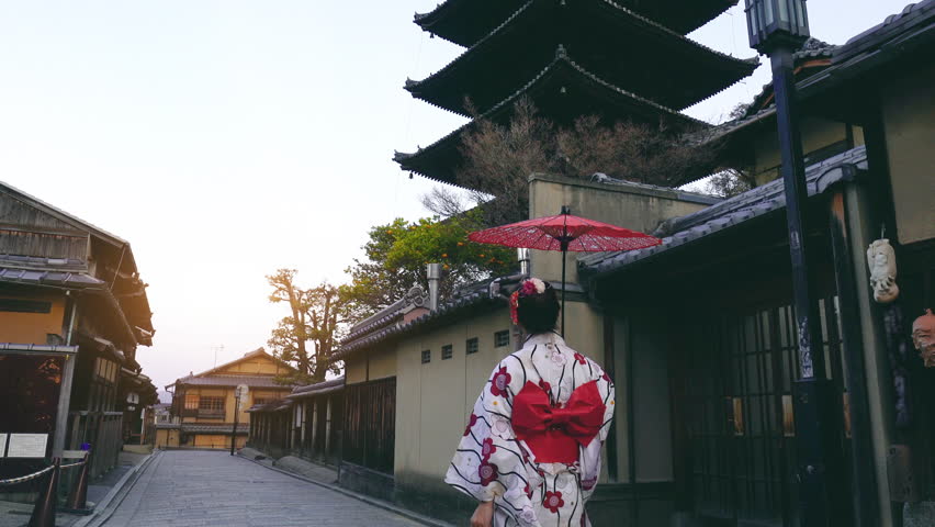 Asian woman wearing japanese traditional kimono at Yasaka Pagoda and Sannen Zaka Street in Kyoto, Japan.