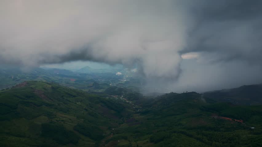 Dramatic dark storm clouds moving fast across the sky. Rolling puffy cumulus formations in nature environment before heavy rain and thunderstorm, 4K.