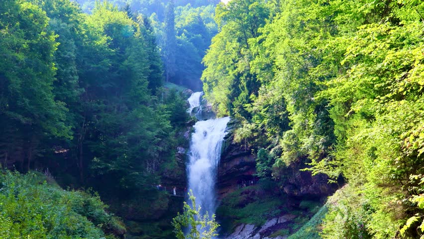 The Giessbach Waterfall crashes dramatically onto the rocks below, sending mist into the cool alpine air. Switzerland, August 16, 2025