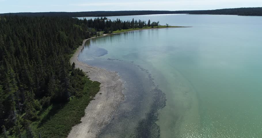 Lac Huard (Loon Lake) on Anticosti Island Shows Crystal Waters Surrounded by Dense Forest and Scattered Lakes, offering a Pristine Landscape in the Heart of Nature and Wilderness