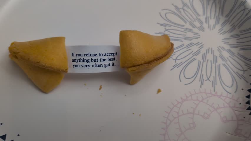 Crescent City, CA – August 25, 2025 Time-lapse Slow-motion closeup of an inspiring fortune cookie message: "If you refuse to accept nothing but the best you often get it." Visual metaphor for high