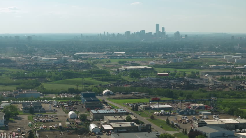 Aerial view of Edmonton skyline with urban and green landscapes