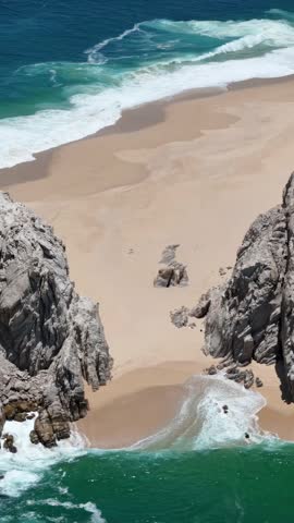 Cabo San Lucas, Mexico. Vertical Drone Shot of Lovers Beach and Ocean Waves on Hot Sunny Day