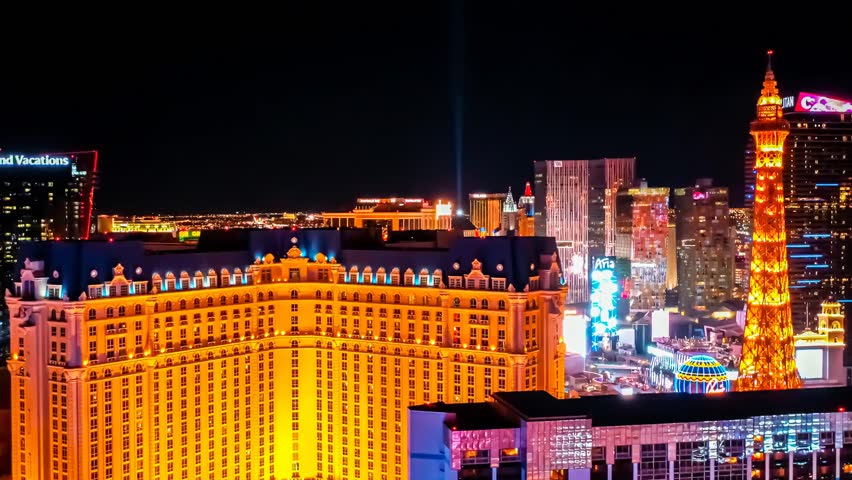 Aerial night view of the Las Vegas Strip, showcasing bright city lights, nightlife, iconic hotels, and entertainment in Sin City.
