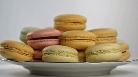 4K close-up of colorful macarons stacked on a white plate, showing texture and pastel tones. Perfect for bakery or confectionery themes.
 - Powered by Shutterstock - Get 15% off with code: PIKWIZARD15